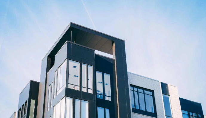 black and white cocnrete building low-angle photography